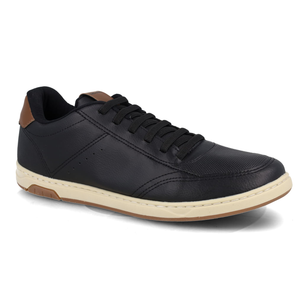Tênis casual masculino preto vista lateral com detalhes em couro sintético marrom e solado branco